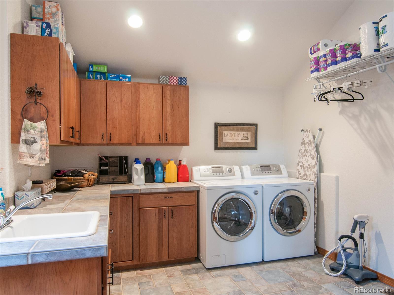 850 Royal Ridge Drive Bailey, CO 80421 - Photo 15 of 35 a utility room with sink dryer and washer
