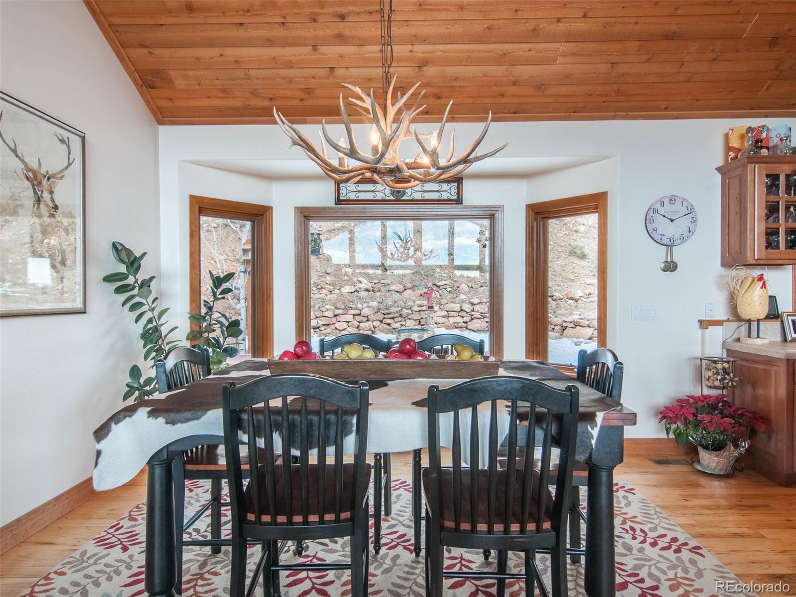 850 Royal Ridge Drive Bailey, CO 80421 - Photo 18 of 35 a view of a dining room with furniture window and outside view