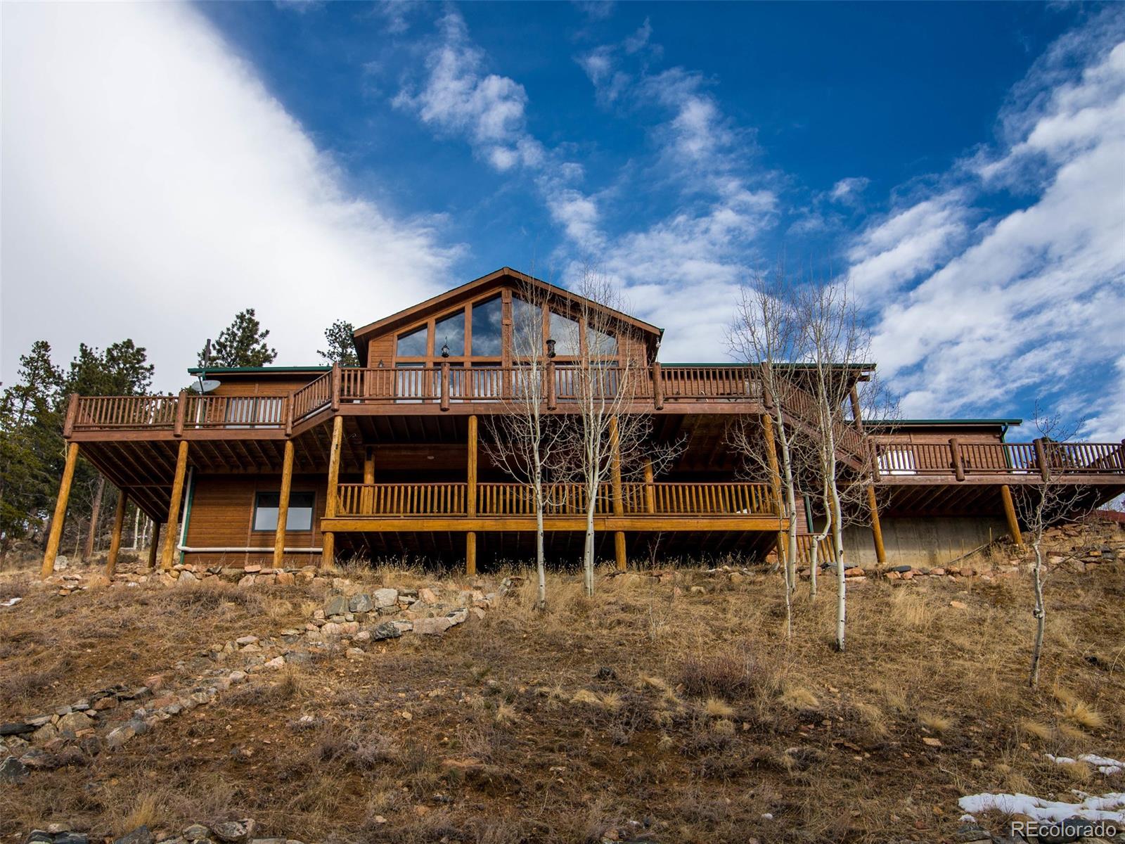 850 Royal Ridge Drive Bailey, CO 80421 - Photo 2 of 35 an front view of a house with a yard