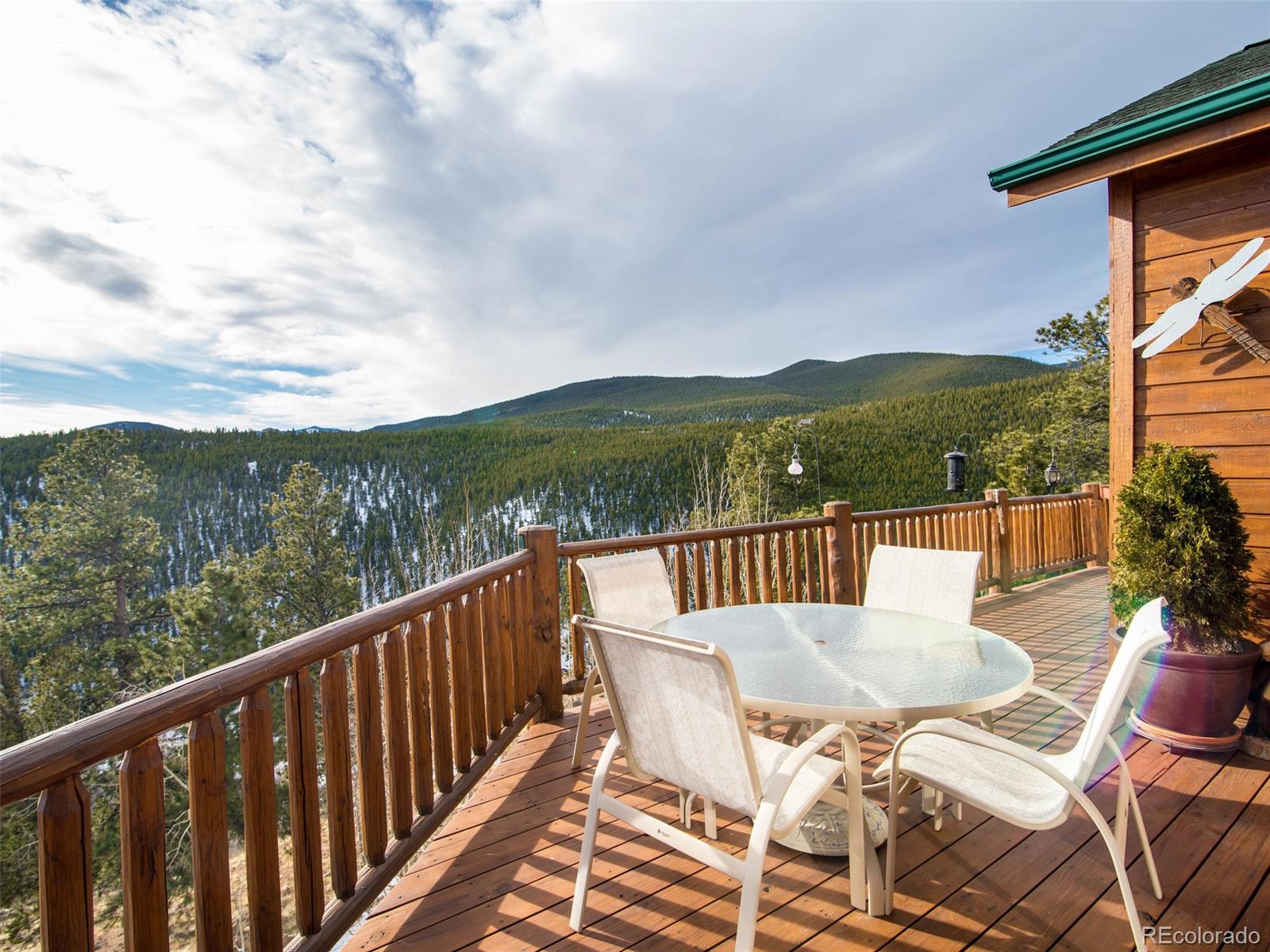 850 Royal Ridge Drive Bailey, CO 80421 - Photo 33 of 35 a view of a chairs and table on the balcony