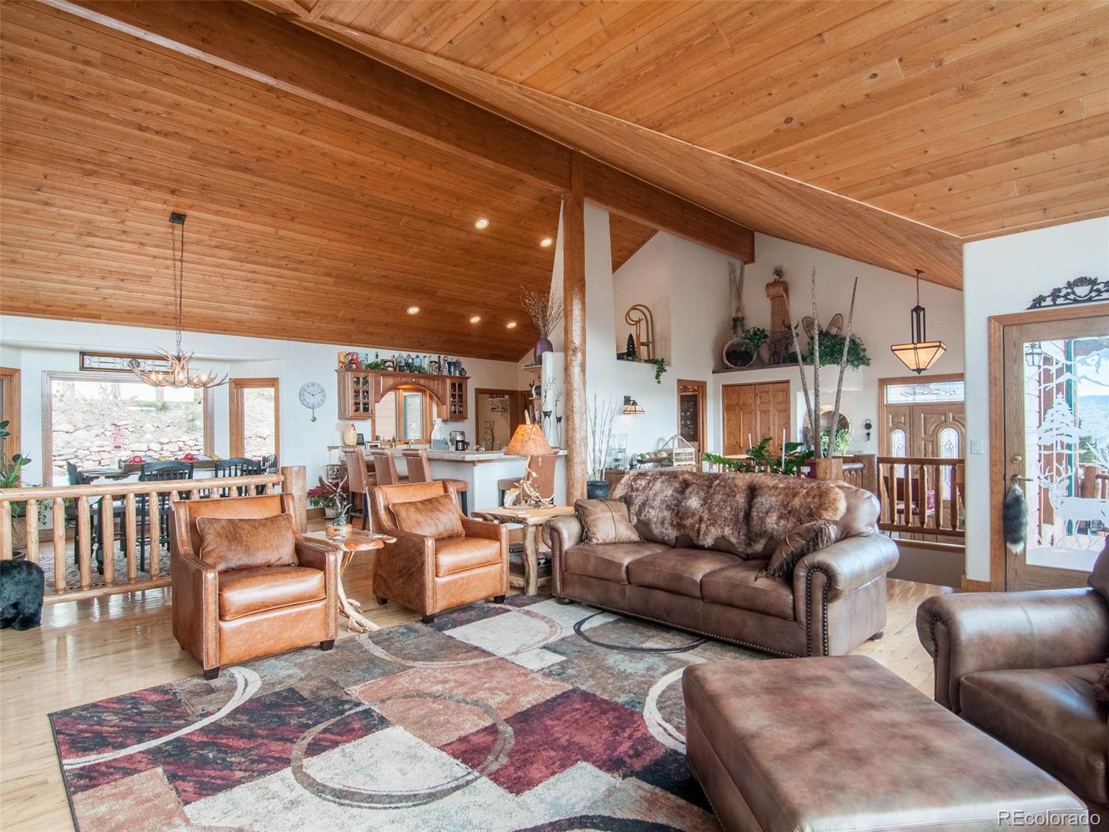 850 Royal Ridge Drive Bailey, CO 80421 - Photo 7 of 35 a living room with furniture and a large window