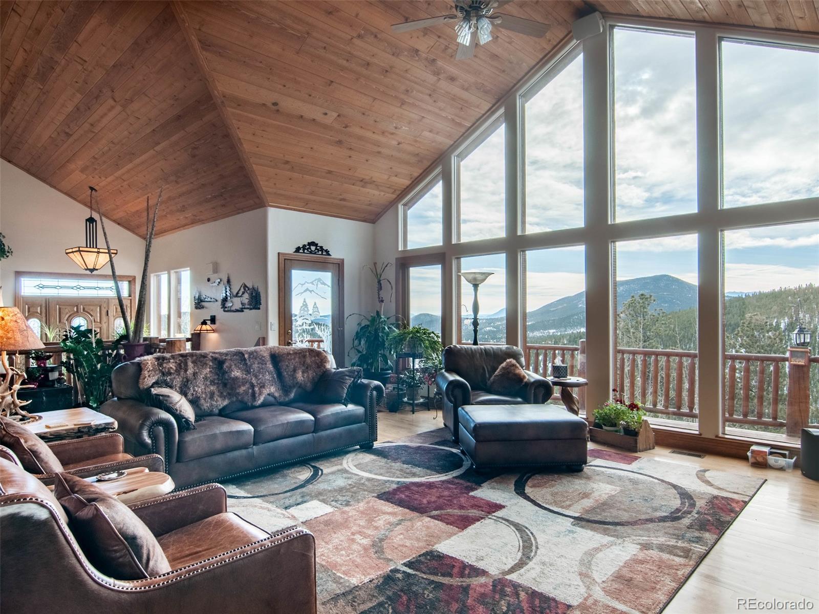 850 Royal Ridge Drive Bailey, CO 80421 - Photo 10 of 35 a living room with furniture and a large window