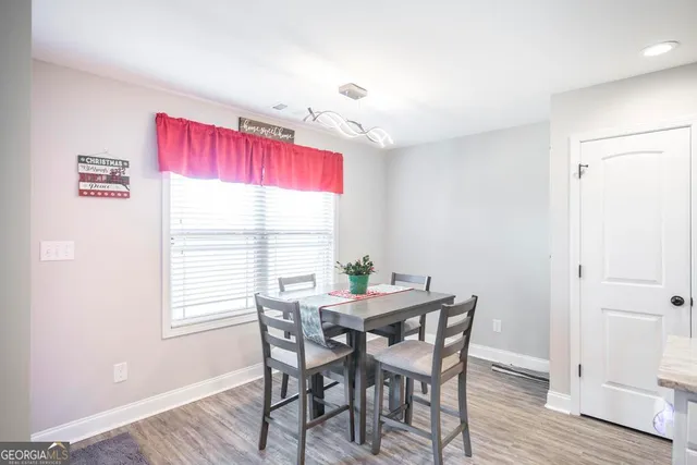 a kitchen with a sink stove and refrigerator