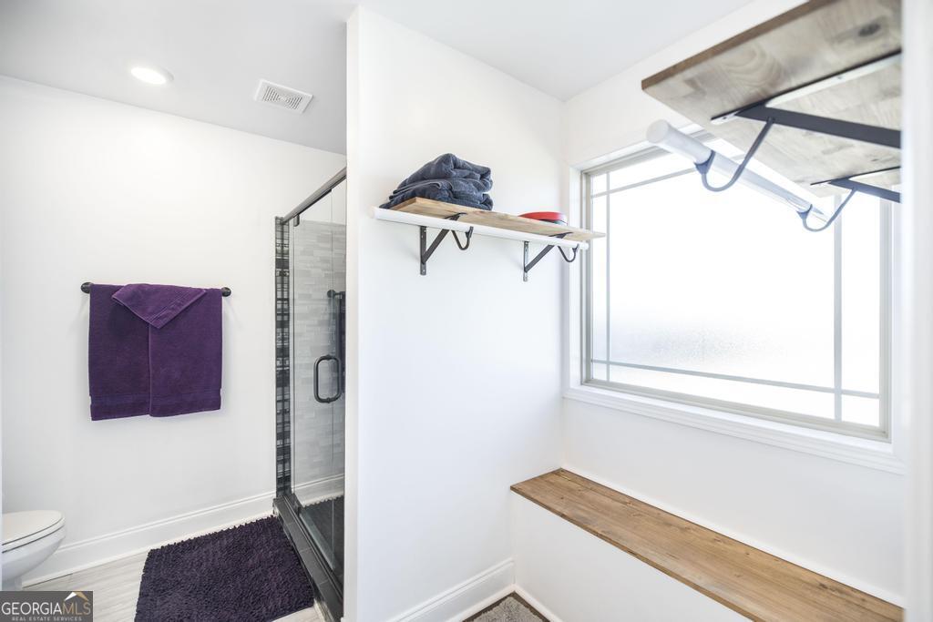 132 Sadie Heights Boulevard Perry, GA 31069 - Photo 18 of 29 a hallway with a couch