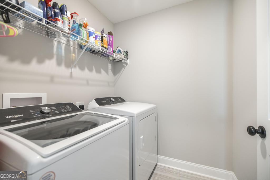 132 Sadie Heights Boulevard Perry, GA 31069 - Photo 21 of 29 a utility room with dryer and washer