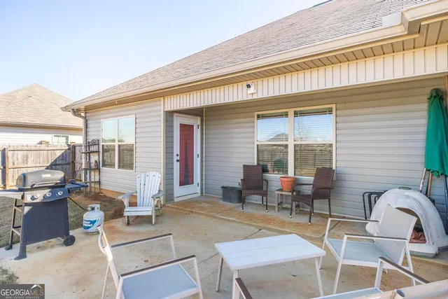 a house with a swimming pool in front of it
