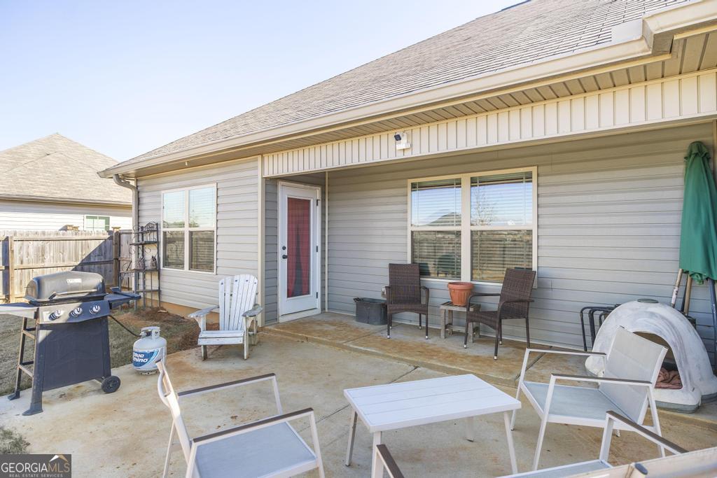 132 Sadie Heights Boulevard Perry, GA 31069 - Photo 25 of 29 a backyard of a house with seating space
