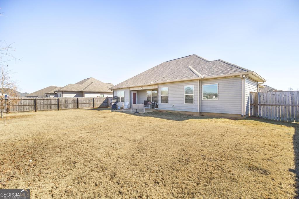 132 Sadie Heights Boulevard Perry, GA 31069 - Photo 26 of 29 a house with a swimming pool in front of it