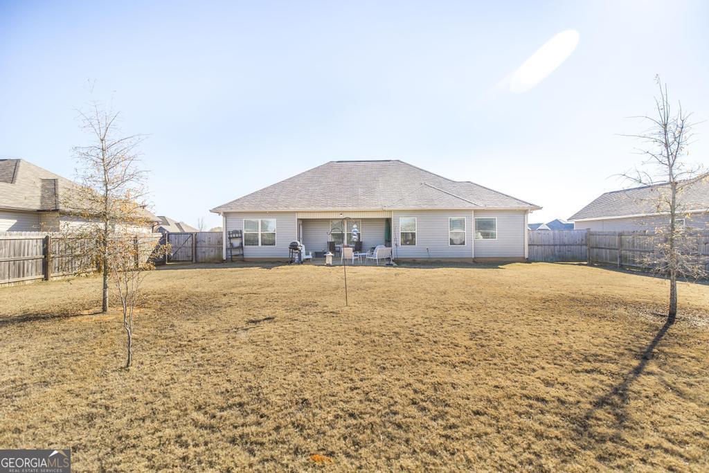132 Sadie Heights Boulevard Perry, GA 31069 - Photo 27 of 29 a house with a yard