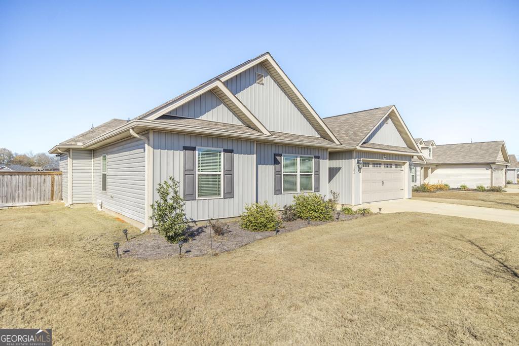 132 Sadie Heights Boulevard Perry, GA 31069 - Photo 4 of 29 a front view of a house with garden