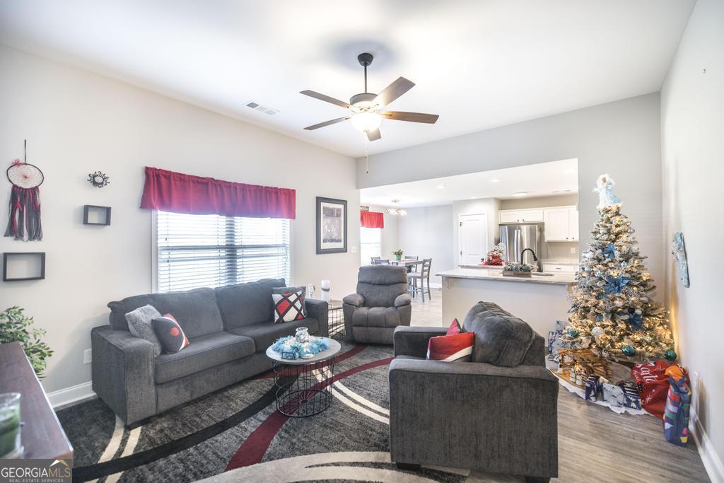 132 Sadie Heights Boulevard Perry, GA 31069 - Photo 8 of 29 a living room with furniture and a large window