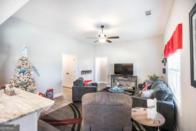 a view of kitchen with kitchen island dining table and chairs
