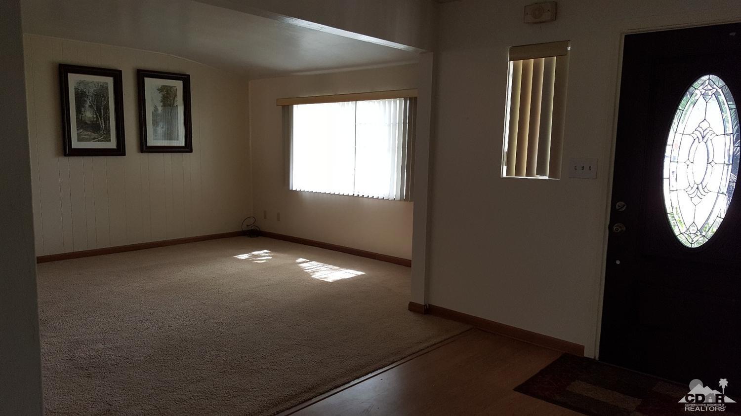 82320 Luce Court Indio, CA 92201 - Photo 3 of 11 an empty room with windows
