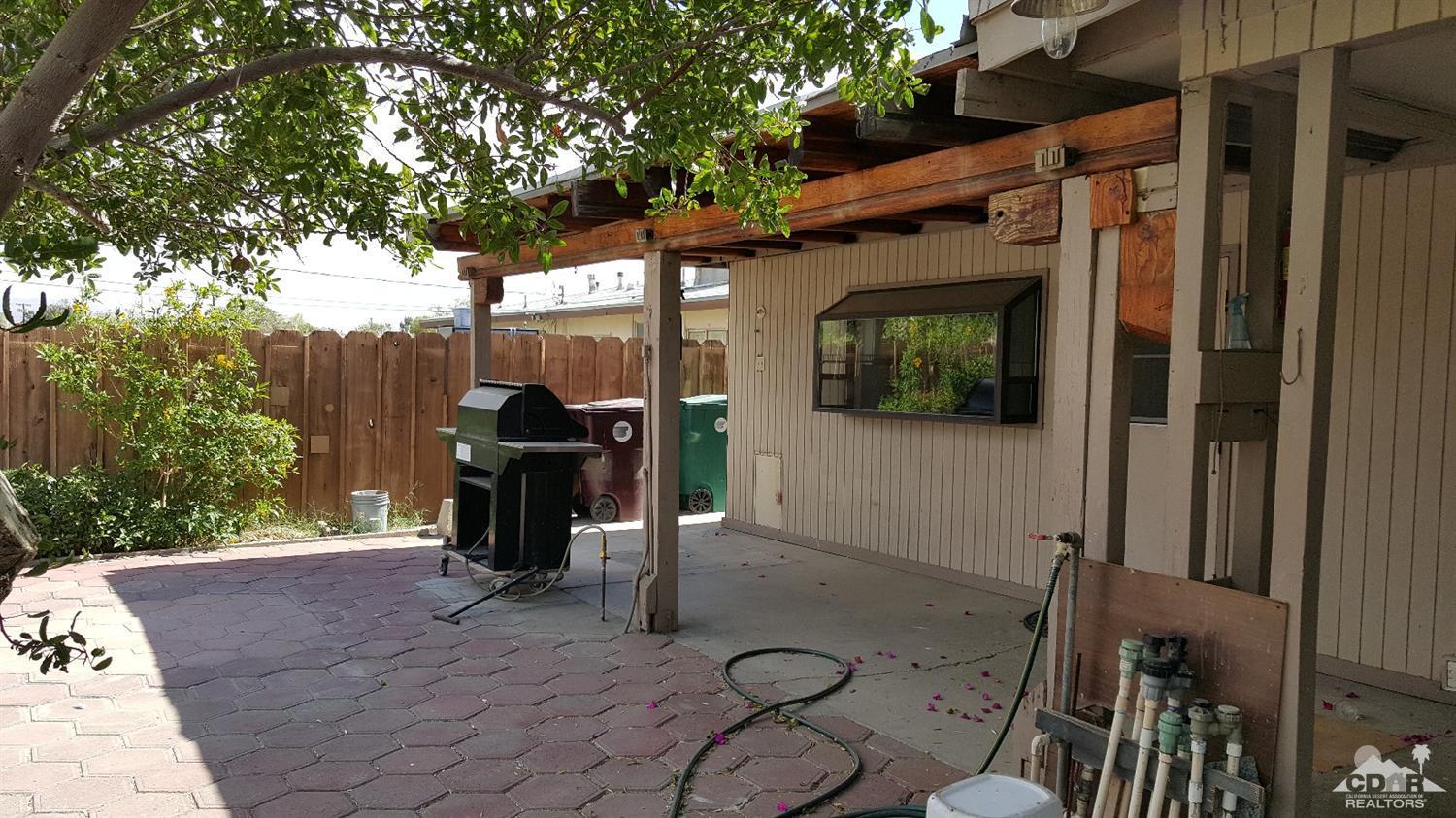 82320 Luce Court Indio, CA 92201 - Photo 10 of 11 a front view of a house with outdoor seating