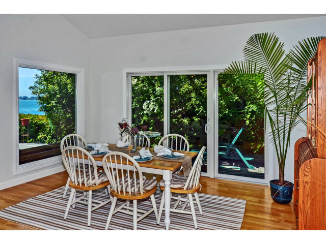 721 Seacliff Drive Aptos, CA 95003 - Photo 6 of 15 a dining room with furniture and a floor to ceiling window