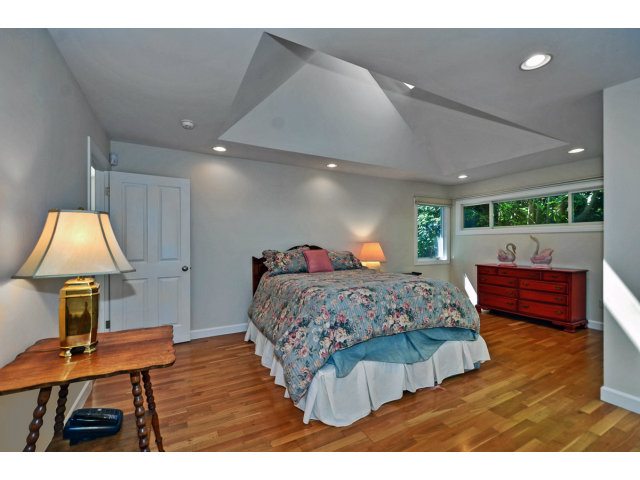 721 Seacliff Drive Aptos, CA 95003 - Photo 7 of 15 a bed room with a bed and a chair