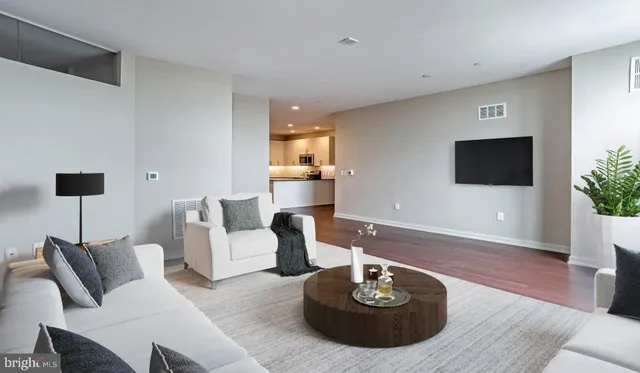 a kitchen with stainless steel appliances a refrigerator a sink a stove a microwave and island