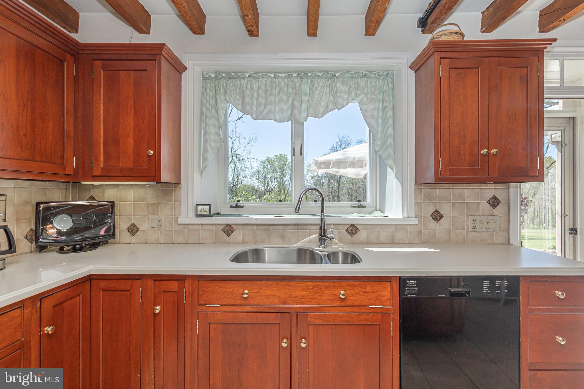 1193 Swamp Road Furlong, PA 18925 - Photo 28 of 70 Kitchen overlooking the serene backyard