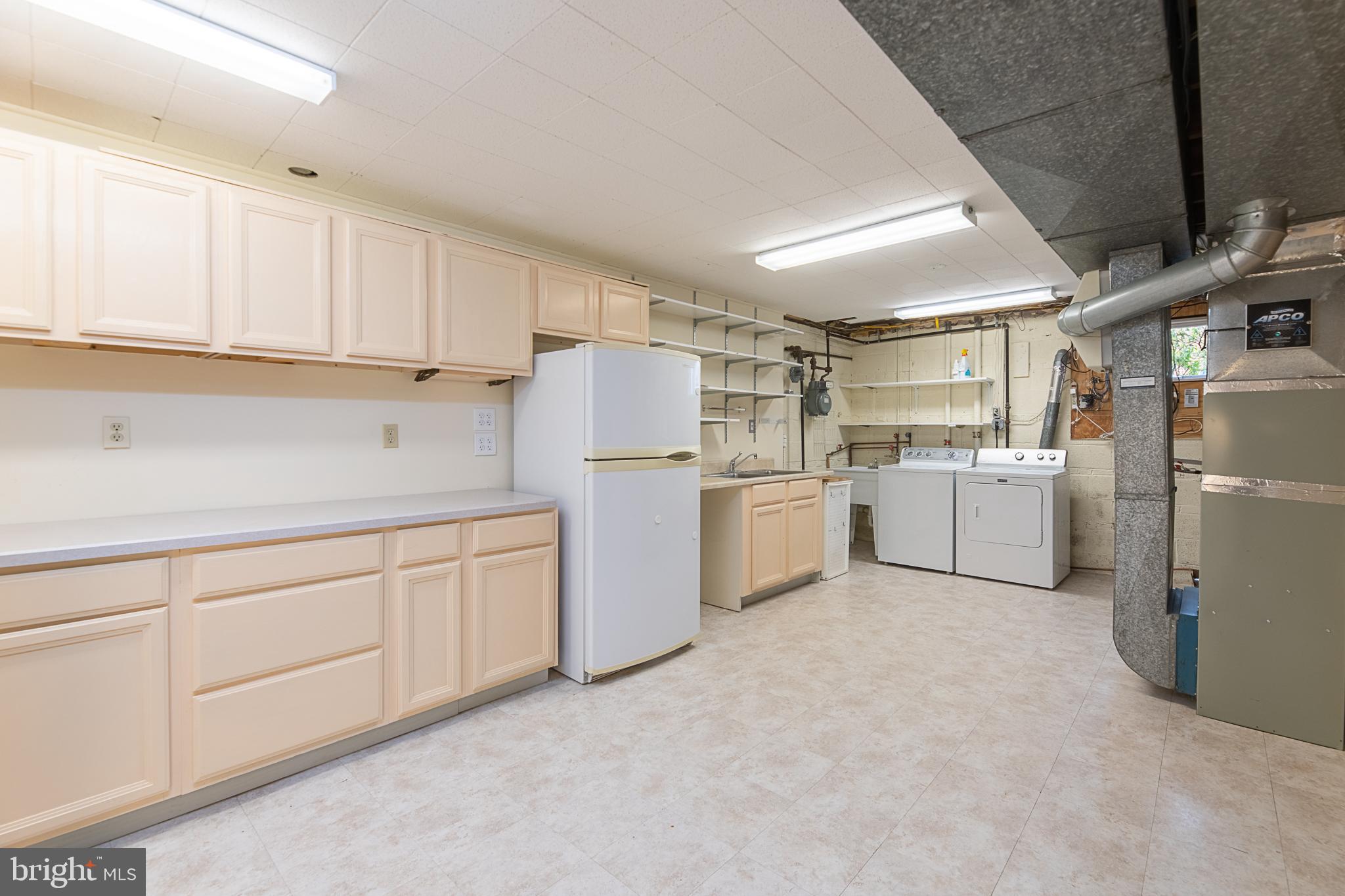 1830 Opalocka Drive McLean, VA 22101 - Photo 50 of 69 Tons of cabinets in laundry/workshop