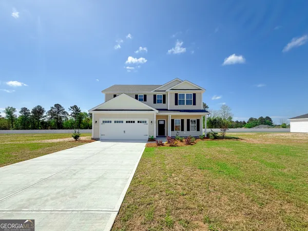 a view of a house with a big yard