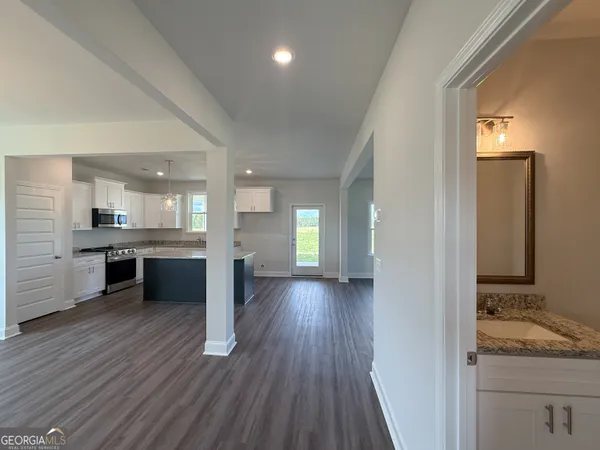 a view of a kitchen with a sink and cabinets