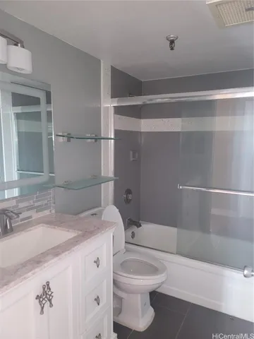 a bathroom with a sink a toilet and bathtub