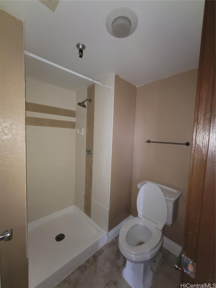 98-487 Koauka Loop, Unit B1603 Aiea, HI 96701 - Photo 13 of 20 a bathroom with a toilet and a shower