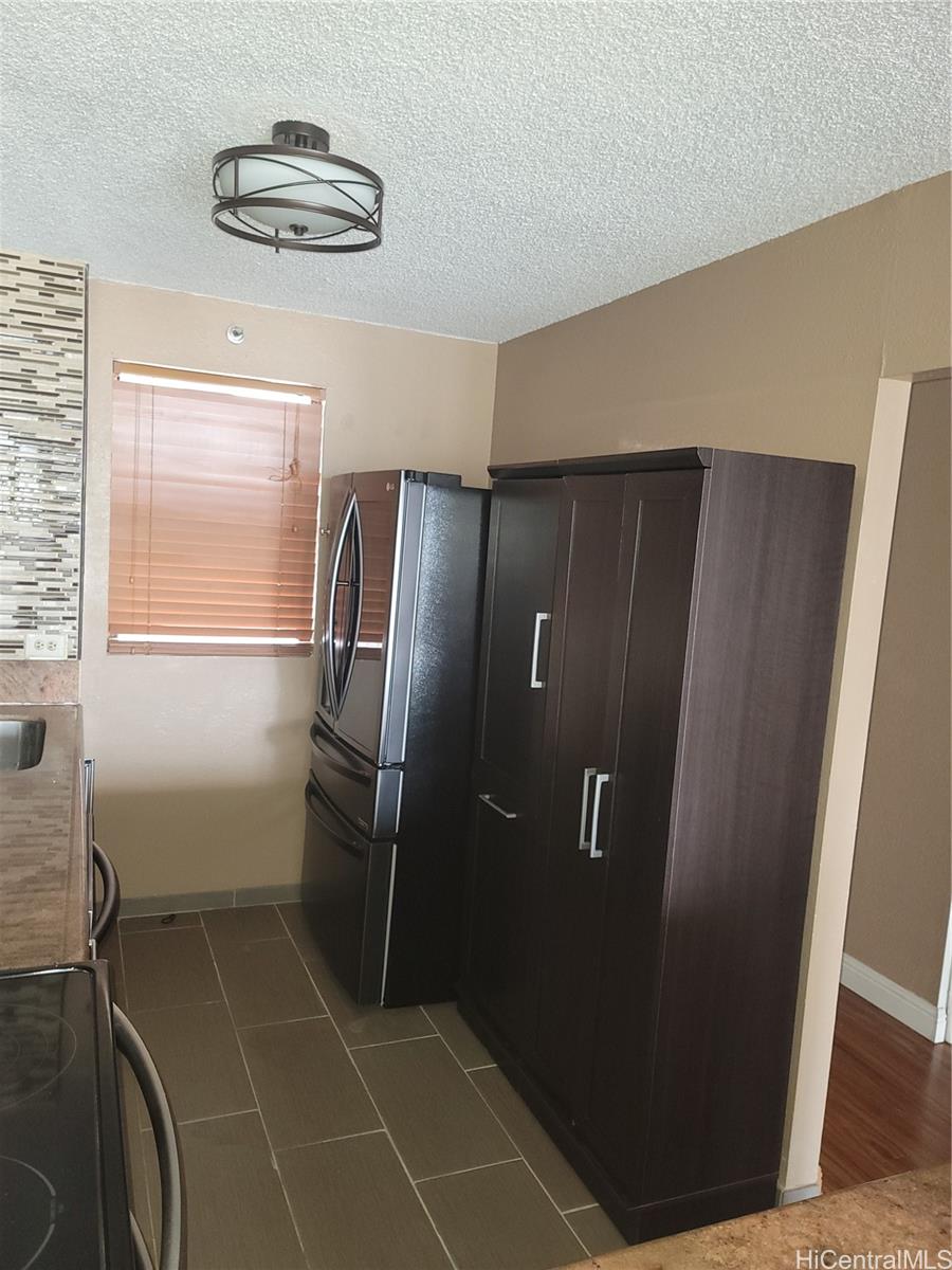 98-487 Koauka Loop, Unit B1603 Aiea, HI 96701 - Photo 5 of 20 a bathroom with a shower and a sink