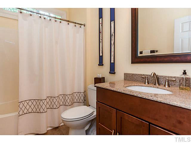 12308 Galway Drive Raleigh, NC 27613 - Photo 13 of 25 The main floor has a newly refinished FULL bathroom with beautiful cabinetry style vanity with granite top.