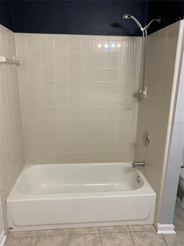 a view of a room with wooden floor and staircase