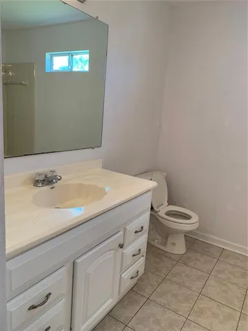 a view of an empty room with large windows