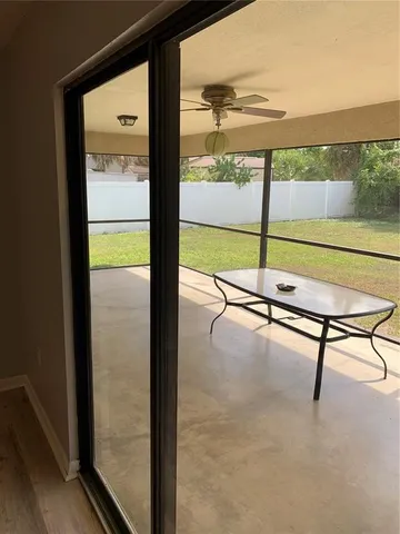 a view of a swimming pool and a yard
