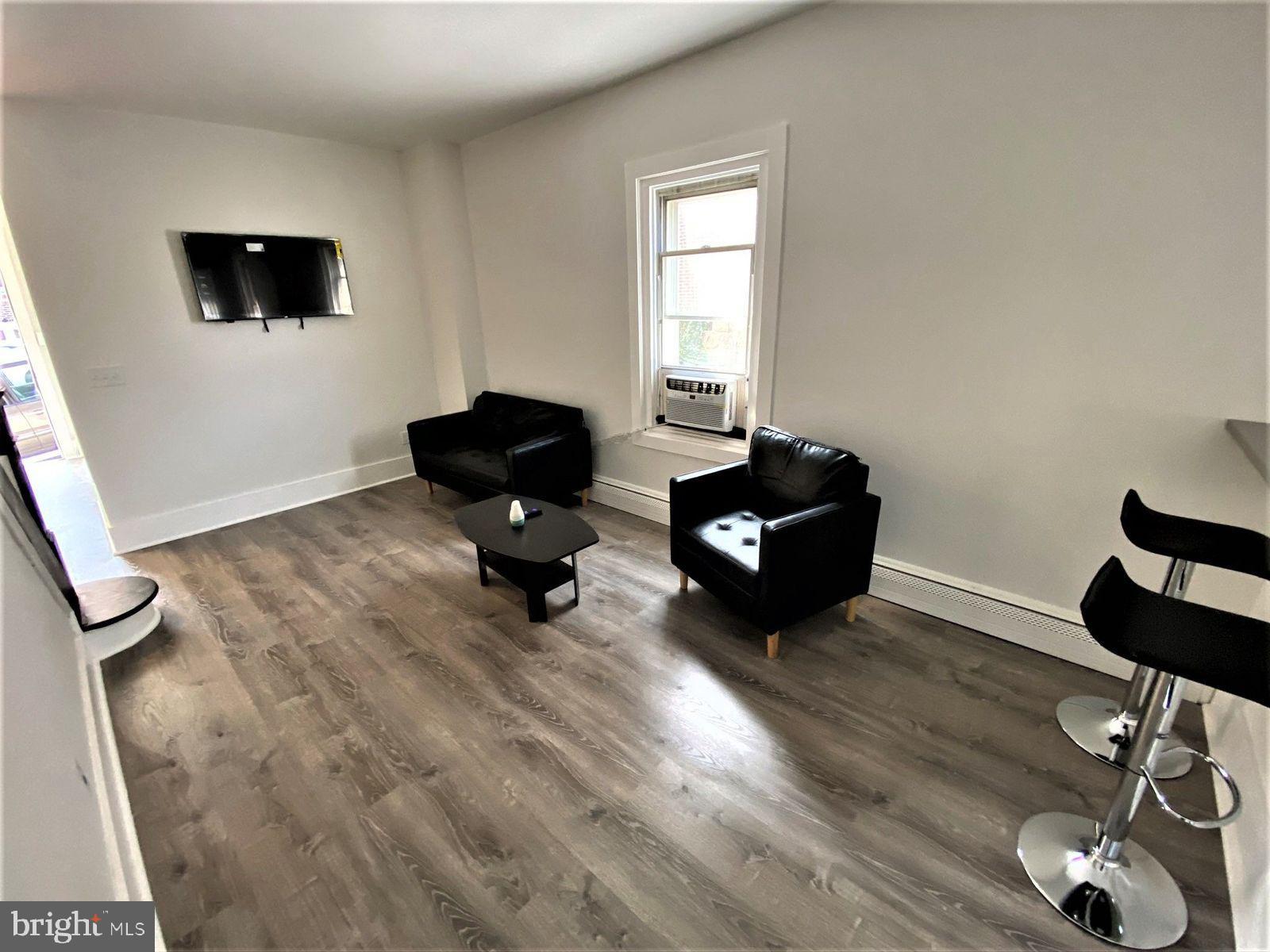 515 Thomas Street Bethlehem, PA 18015 - Photo 16 of 30 a living room with furniture and a flat screen tv