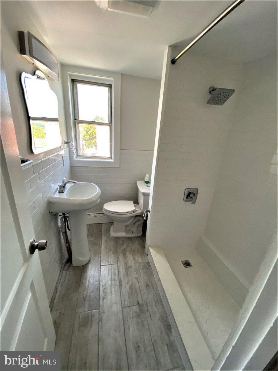 515 Thomas Street Bethlehem, PA 18015 - Photo 17 of 30 a bathroom with a sink a toilet and shower