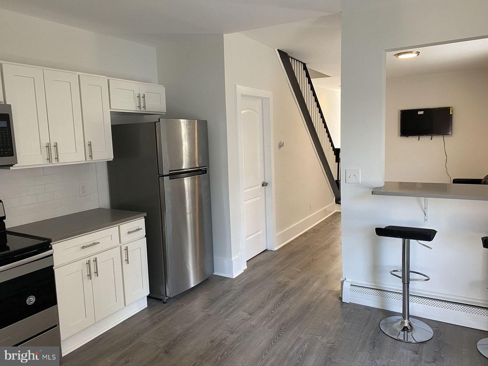 515 Thomas Street Bethlehem, PA 18015 - Photo 2 of 30 a kitchen with a refrigerator and a stove top oven