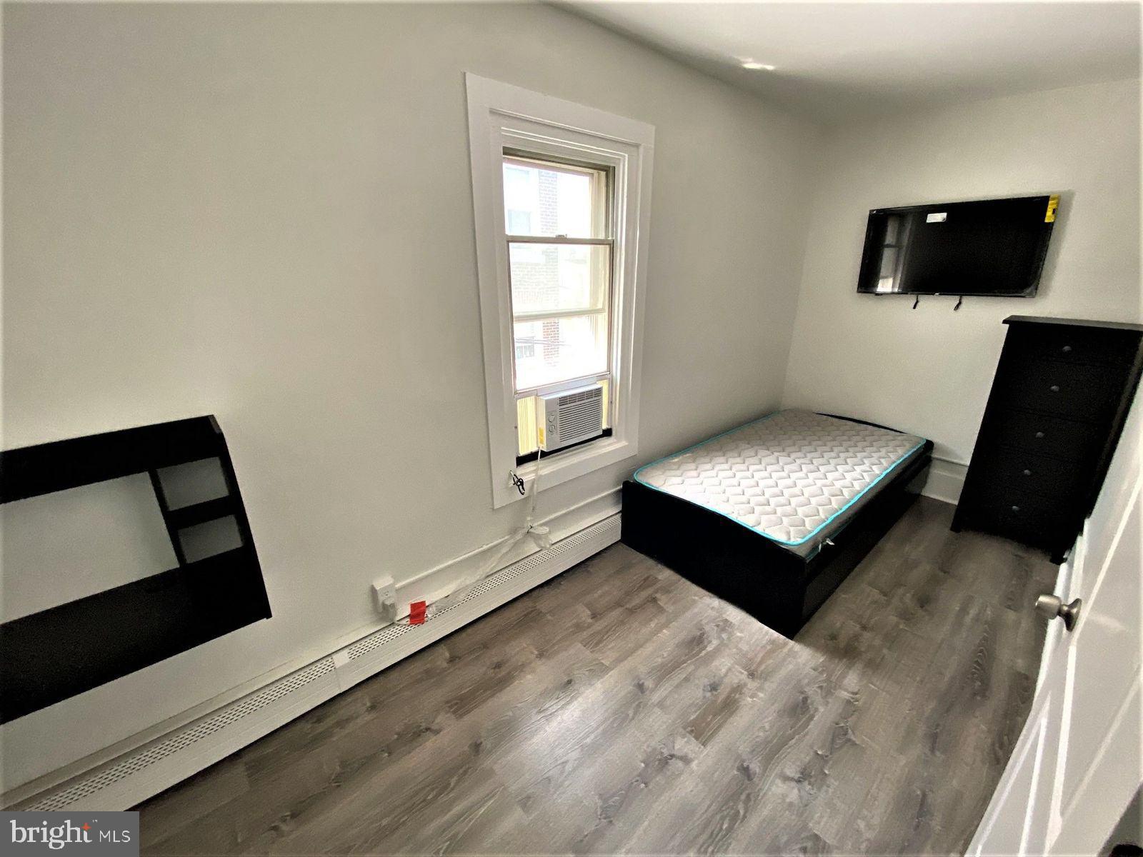 515 Thomas Street Bethlehem, PA 18015 - Photo 21 of 30 a living room with couch and a flat screen tv