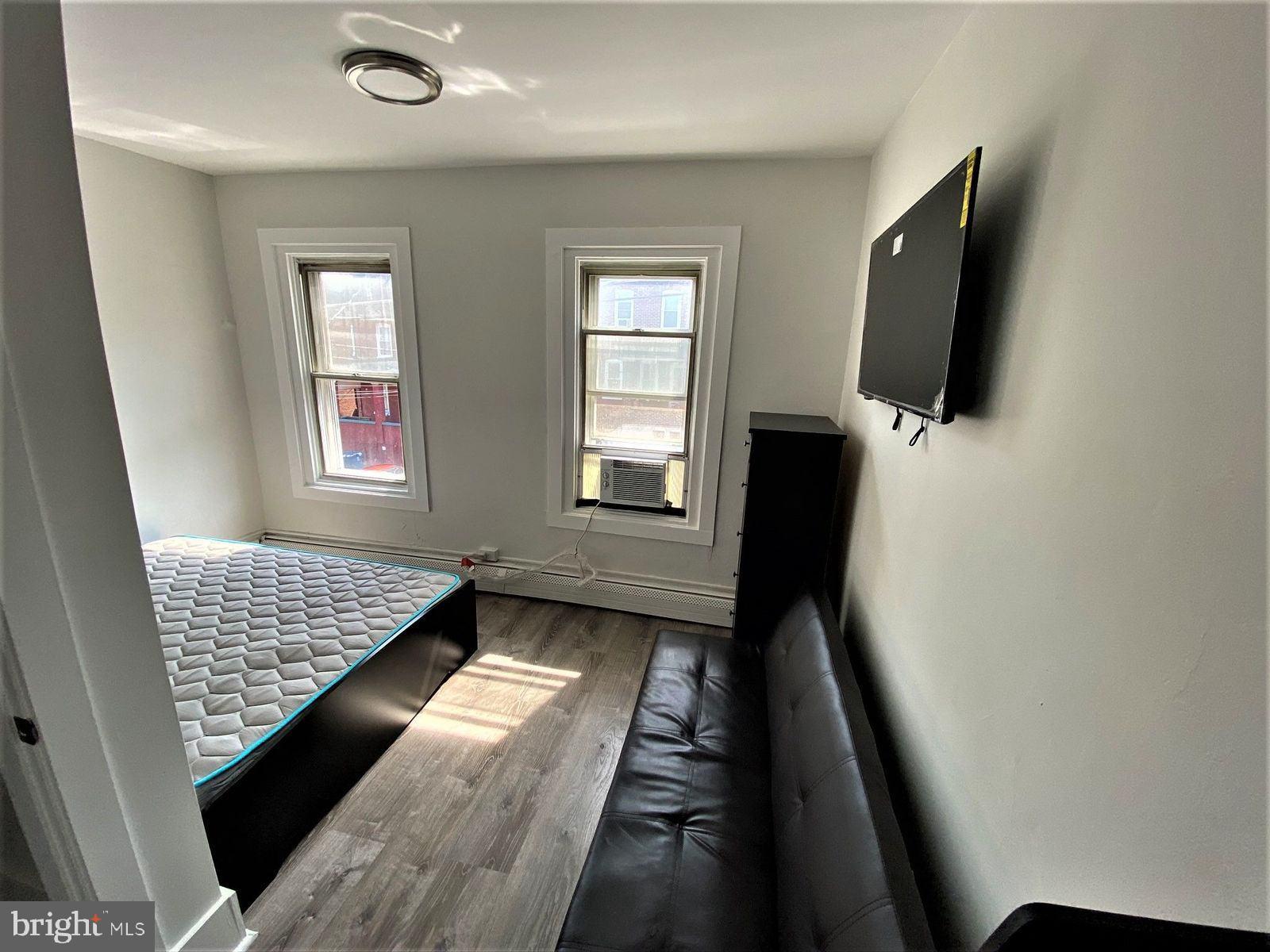 515 Thomas Street Bethlehem, PA 18015 - Photo 24 of 30 a view of an empty room with wooden floor and a window