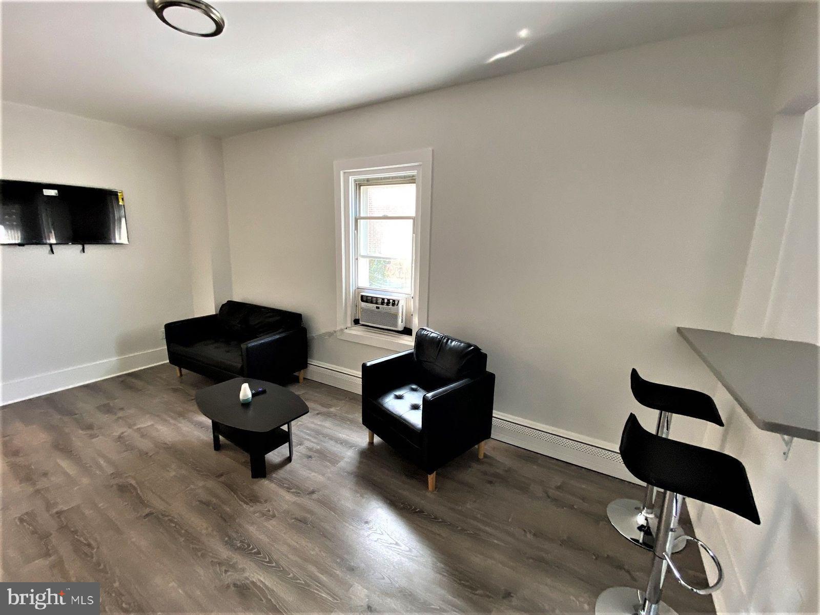 515 Thomas Street Bethlehem, PA 18015 - Photo 30 of 30 a living room with furniture and wooden floor