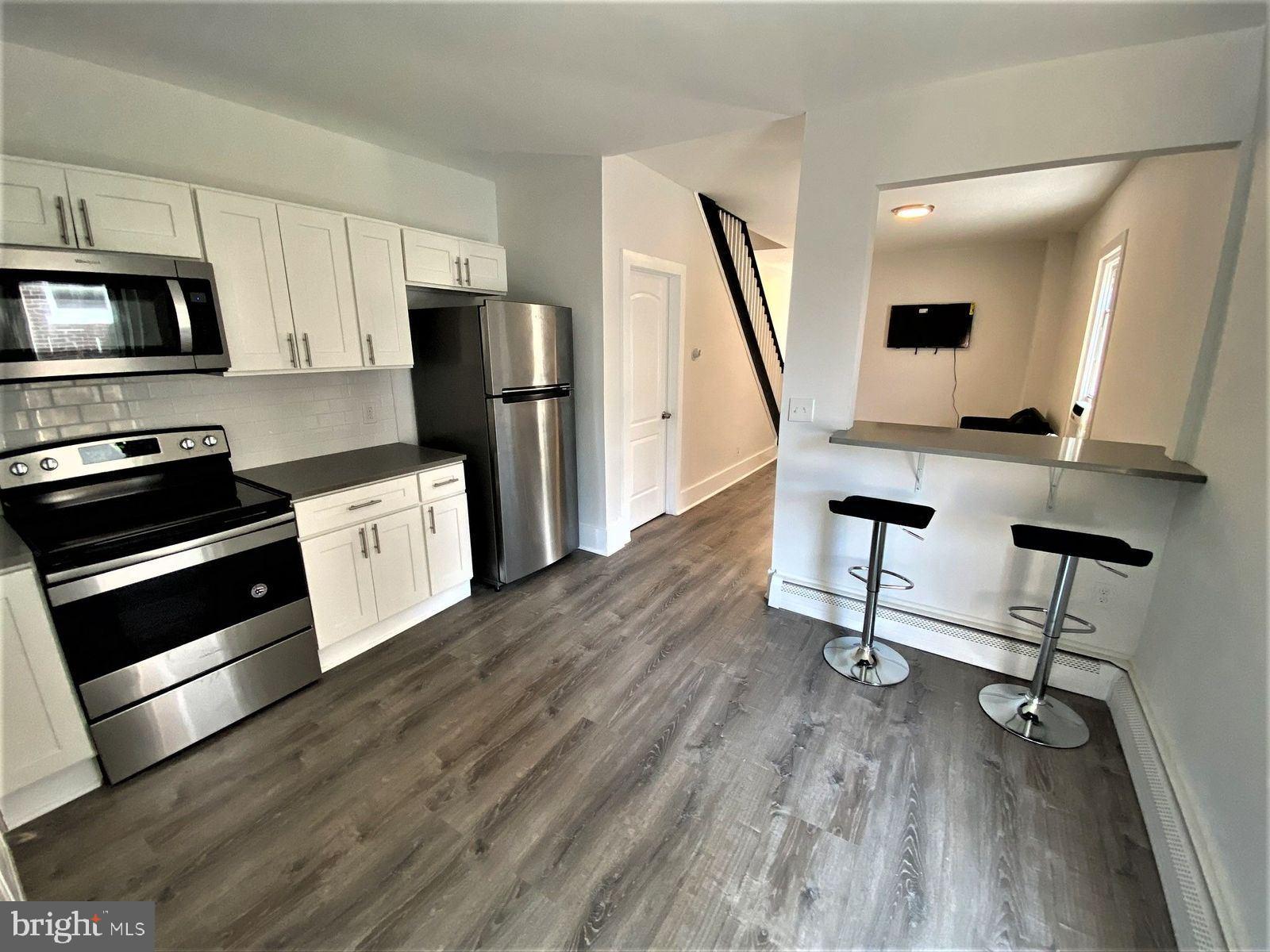 515 Thomas Street Bethlehem, PA 18015 - Photo 3 of 30 a view of kitchen with sink microwave and refrigerator