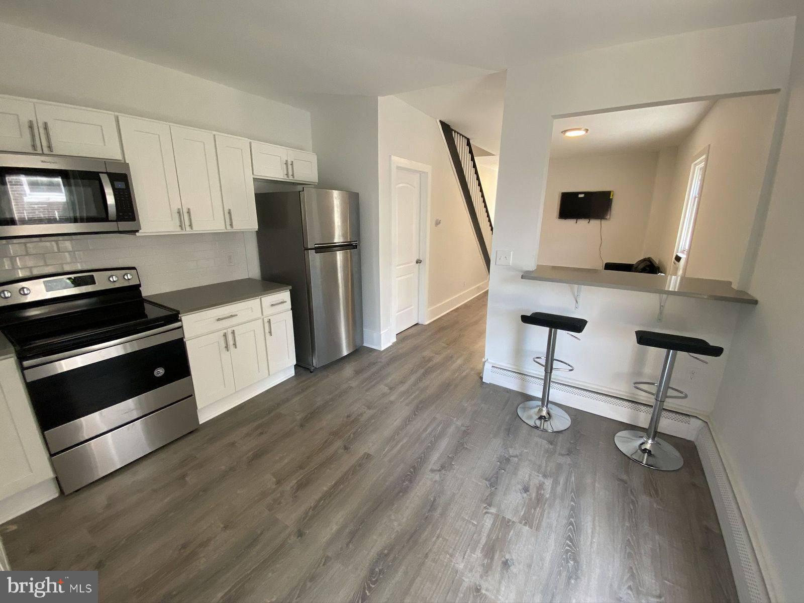 515 Thomas Street Bethlehem, PA 18015 - Photo 4 of 30 a view of kitchen with sink microwave and refrigerator