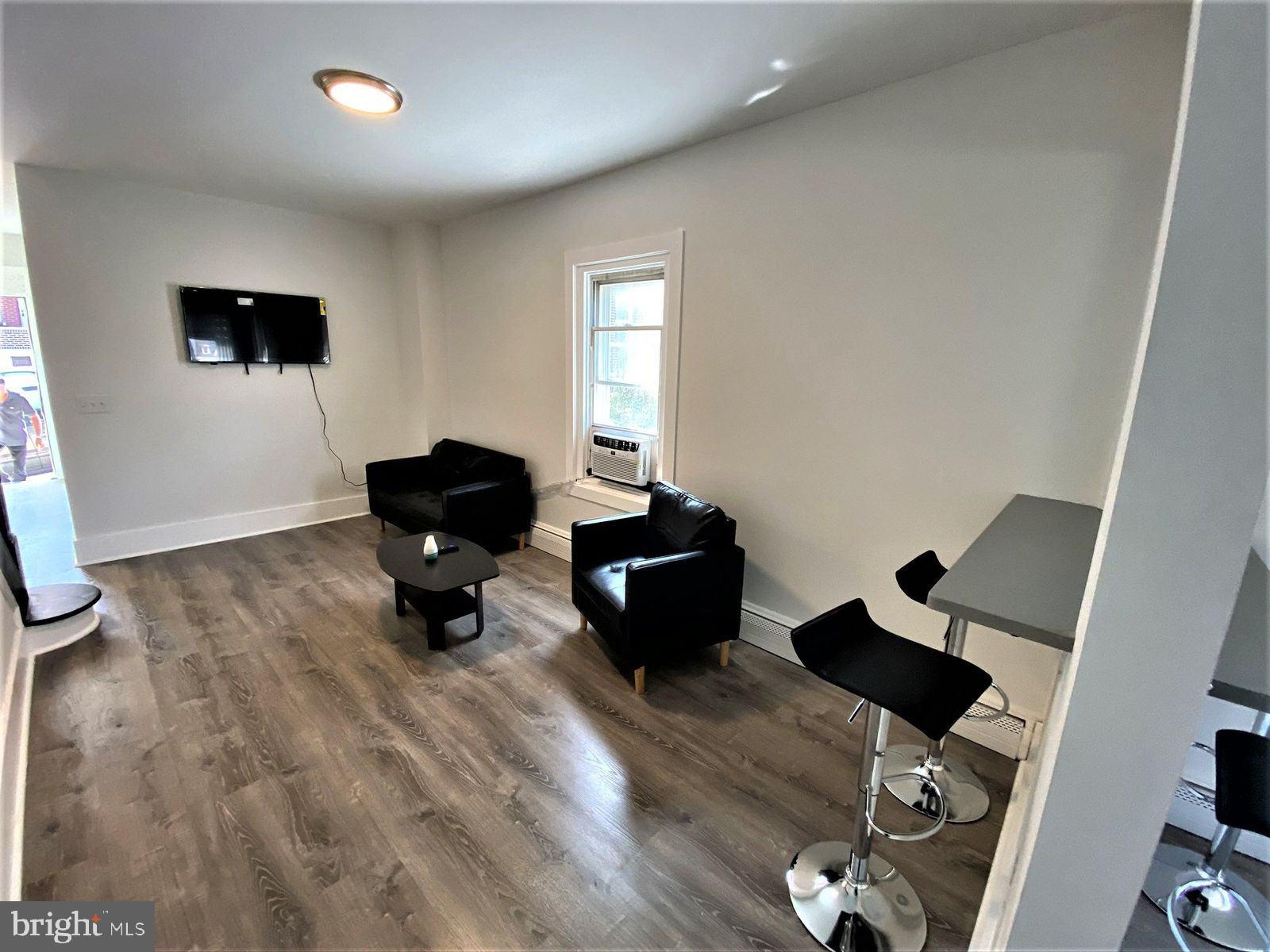 515 Thomas Street Bethlehem, PA 18015 - Photo 7 of 30 a living room with furniture and wooden floor