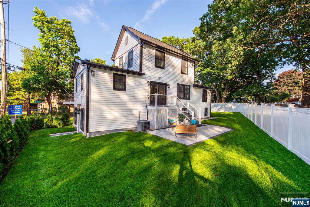 145 Grove Street Mahwah, NJ 07430 - Photo 28 of 30 a front view of house with yard and trees