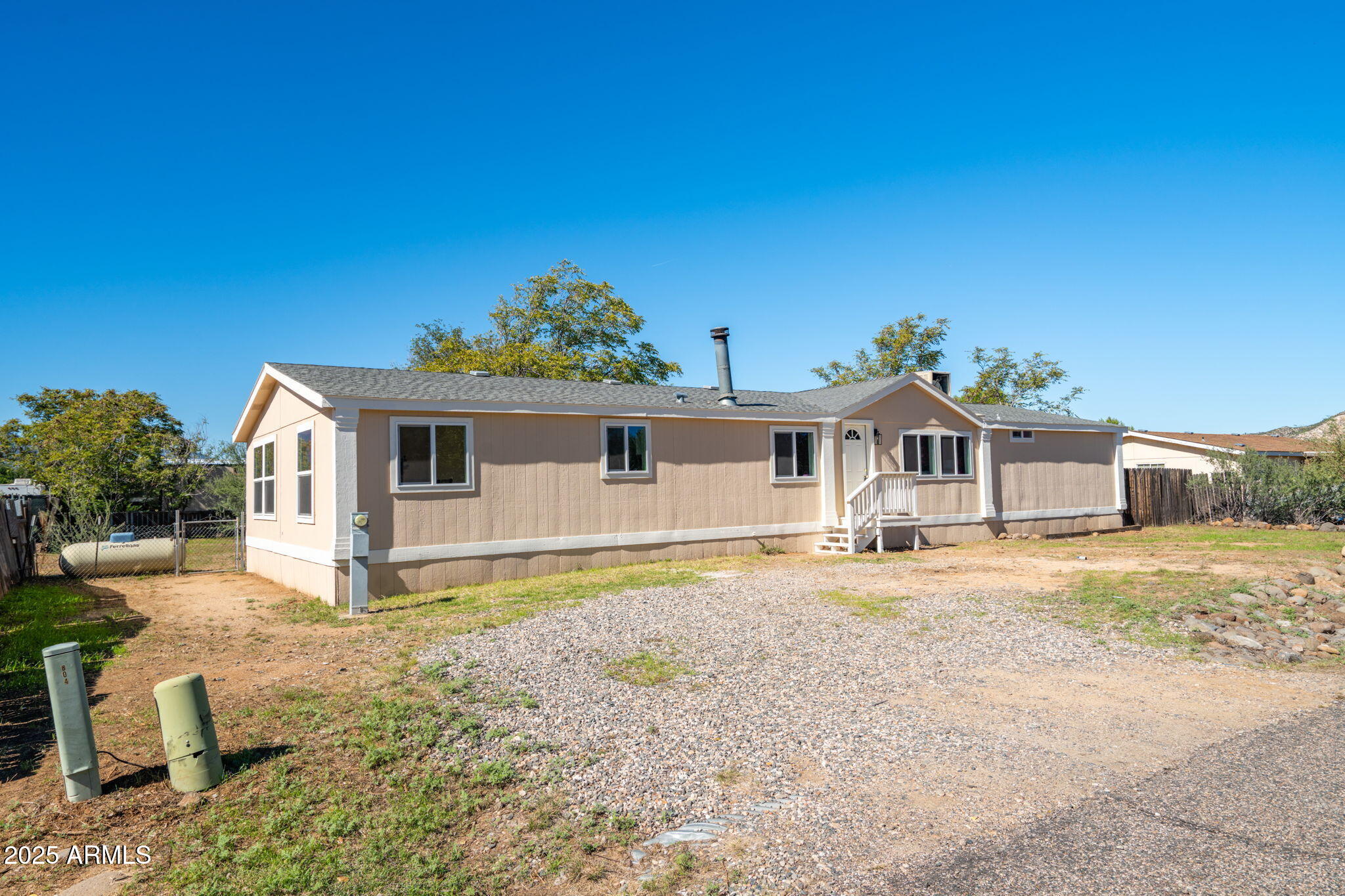 3278 East Ripple Road Camp Verde, AZ 86322 - Photo 2 of 33 a front view of a house with a yard