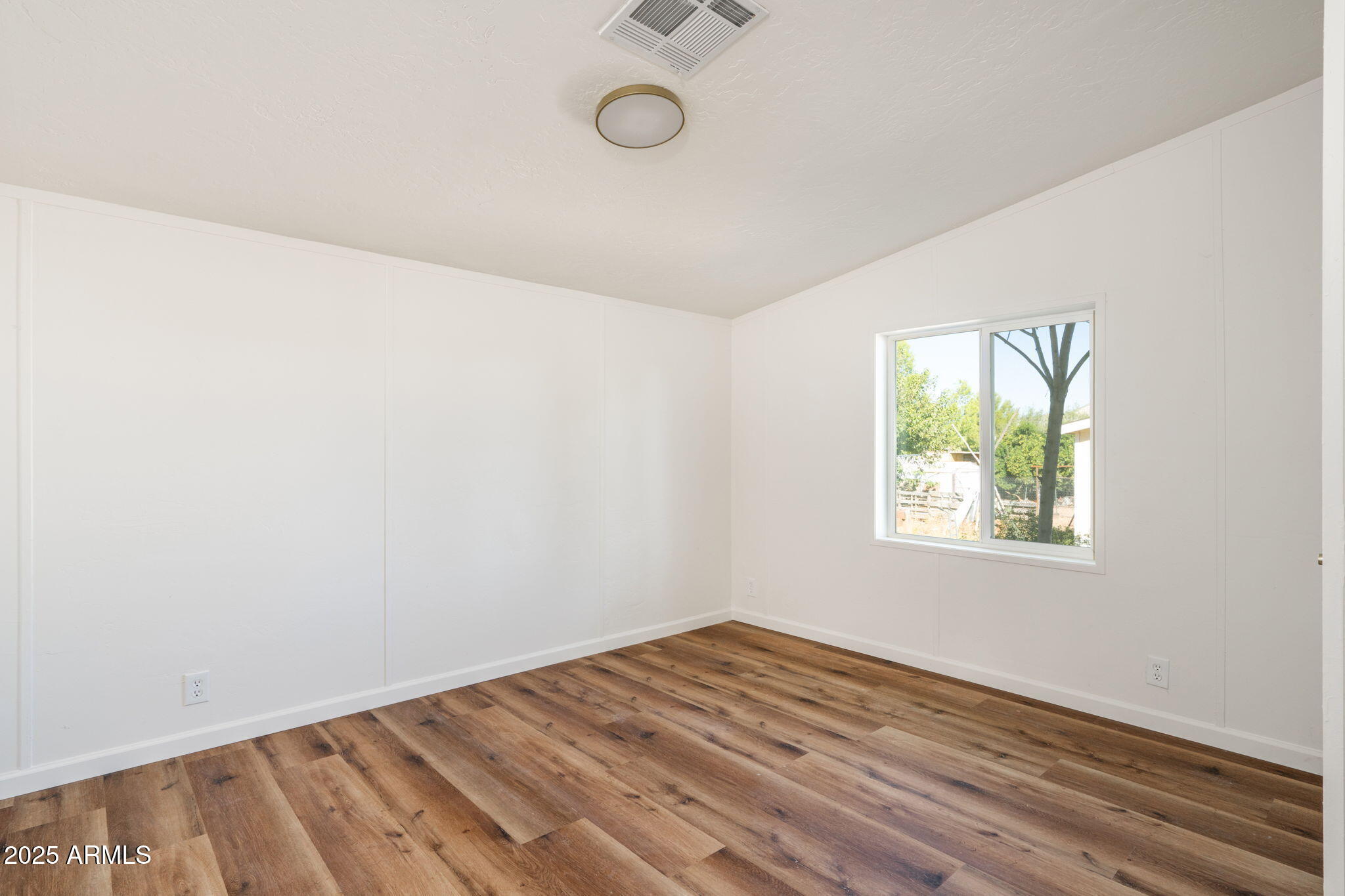3278 East Ripple Road Camp Verde, AZ 86322 - Photo 24 of 33 an empty room with a window