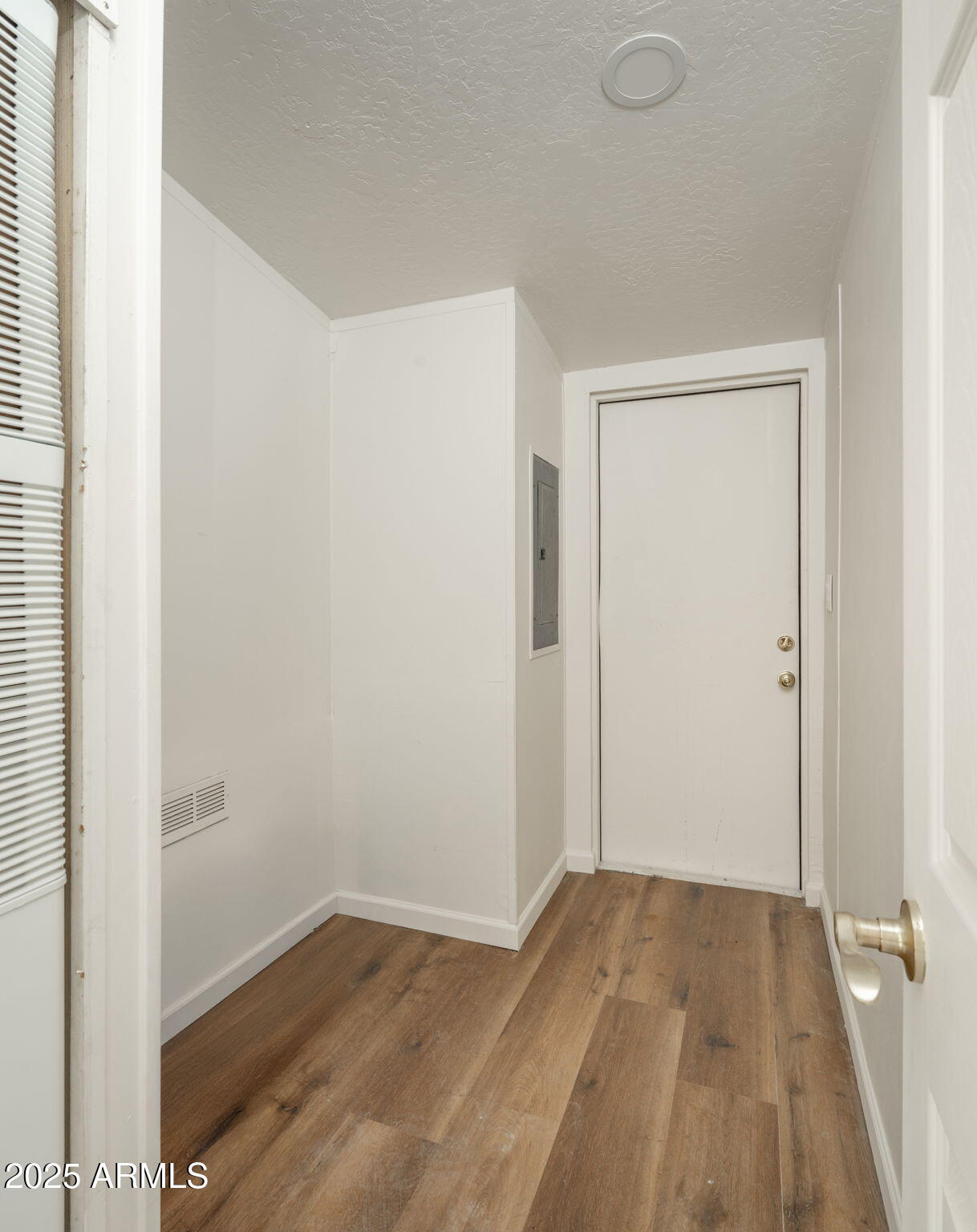 3278 East Ripple Road Camp Verde, AZ 86322 - Photo 29 of 33 a view of a room with wooden floor and a window