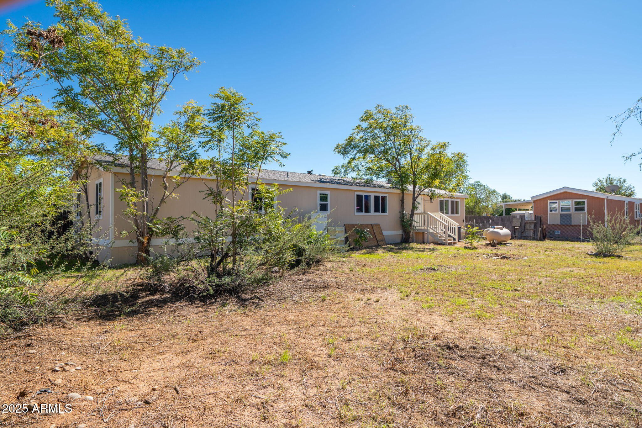 3278 East Ripple Road Camp Verde, AZ 86322 - Photo 32 of 33 a house with trees in front of it