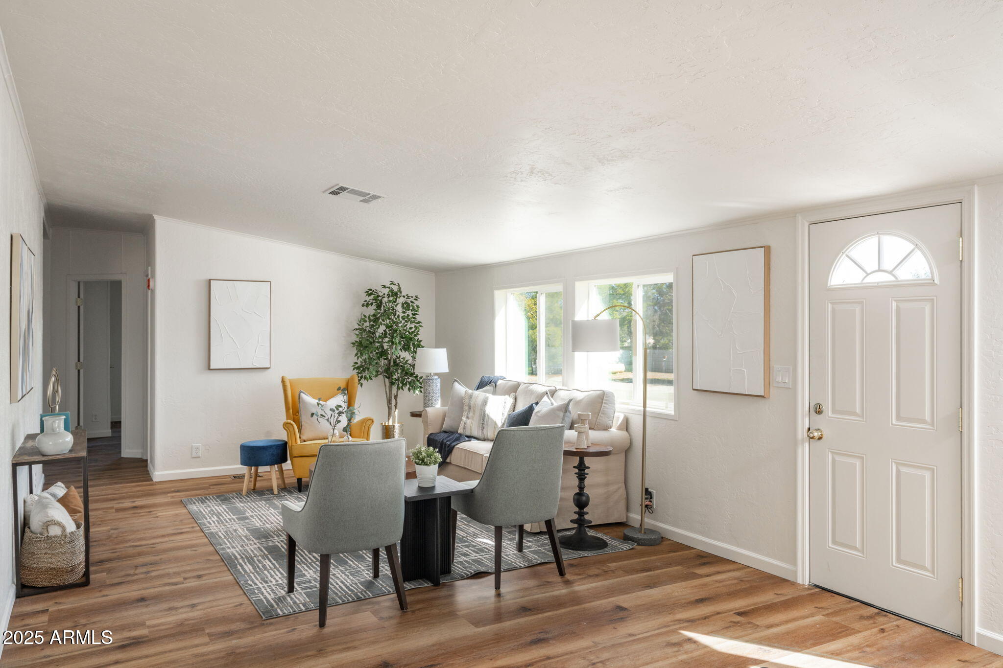 3278 East Ripple Road Camp Verde, AZ 86322 - Photo 5 of 33 a view of a dining room with furniture window and wooden floor