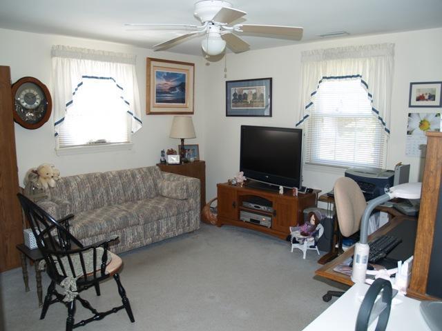 252 Training Field Road Chatham, MA 02633 - Photo 4 of 10 a living room with furniture and a flat screen tv