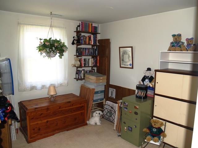 252 Training Field Road Chatham, MA 02633 - Photo 6 of 10 a room with a refrigerator and a flat screen tv