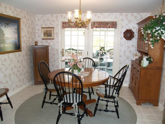252 Training Field Road Chatham, MA 02633 - Photo 9 of 10 a view of a dining room with furniture and chandelier